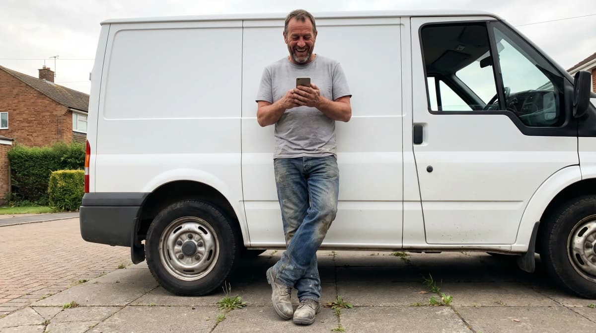 Confident British tradesman using Jobnix